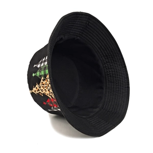 Black bucket hat featuring colorful Christmas tree prints and reversible cotton lining
