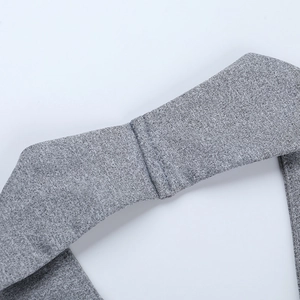 Detail shot of grey knitted fabric texture and reinforced flat seam on the top