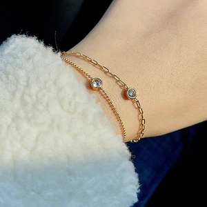 Double-layered 18k gold plated stainless steel paperclip and bead bracelet with zircons