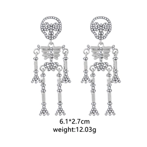 Detailed view of silver skull drop earrings with clear zircons and size measurements