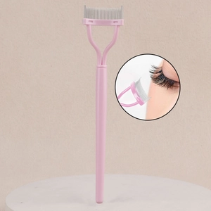 Pink eyelash comb with curved steel teeth for separating lashes and removing mascara clumps