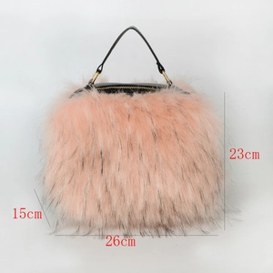 Pink faux fur handbag with black handle showing dimensions 26cm length and 23cm height