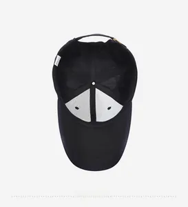 Detail view of the black baseball cap interior with breathable mesh and adjustment buckle