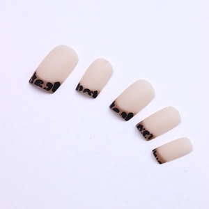 Matte nude press-on nails with classic leopard print French tips in a square-oval shape