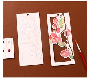 Macro view of DIY watercolor bookmarks set with brushes and pigment cards on leather