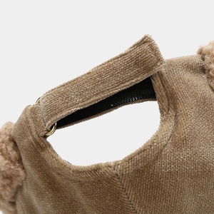 Brown corduroy beanie hat with velcro strap and metal ring adjustment detail