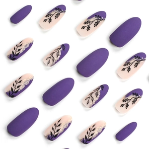 Minimalist purple press-on nails with gold glitter and green leaf patterns on white background