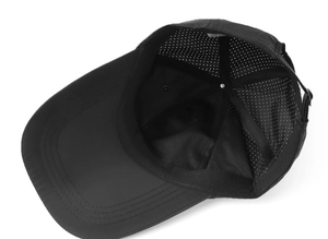 Interior detail view of a black breathable quick-dry baseball cap with mesh lining
