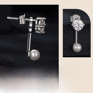 Detailed macro view of S925 sterling silver earrings with round pearl and sparkling zircon