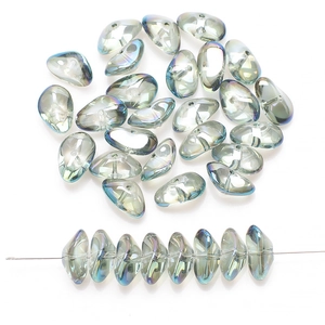 Close-up of irregular iridescent glass beads in blue-green and taupe for DIY jewelry