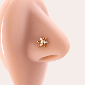 Golden flower 20G titanium steel nose stud with marquise zircon stones on an ear model