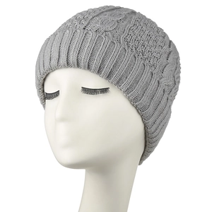 Grey chunky cable knit beanie for women featuring thermal protection and stylish texture
