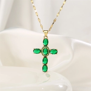 Detailed close-up of 18K gold-plated cross pendant featuring six oval green zircons