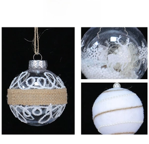 Detailed view of clear glass and flocked Christmas ornaments with reindeer and pearls