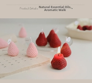 Detailed view of strawberry scented candles in red and pink with natural seed textures