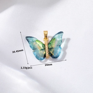 Detailed view of butterfly pendant showing gradient colors and precise dimensions