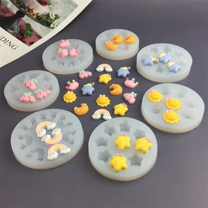 Silicone DIY molds for sun, moon, star, and rainbow shapes, displayed in a 45-degree view