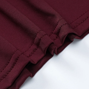Detail shot of wine red knitted fabric featuring high-quality double-needle stitching
