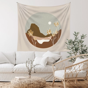 Detail of bohemian tapestry with sun and mountain pattern in a cozy room setting
