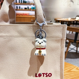 Cute puppy resin keychain with wood carving texture and red collar on canvas bag