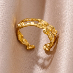 Detailed macro view of 18k gold plated stainless steel ring with lava texture design