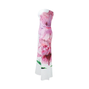 Detailed view of pink floral pattern on elegant white strapless maxi dress fabric