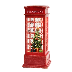 Red Christmas telephone booth snow globe with tree and gift box inside on white background