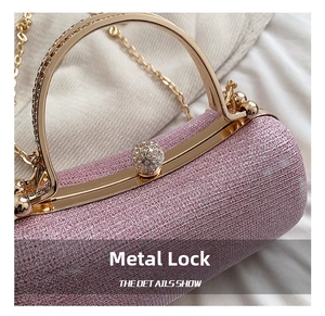 Close-up of pink sequin evening bag with a gold metal frame and sparkling rhinestone clasp