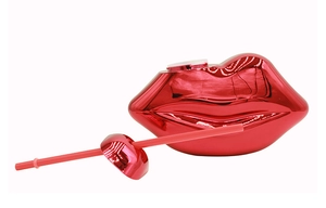 Detailed view of creative lip-shaped disco cup with metallic red finish and straw