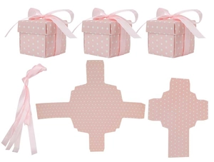 Flat lay of pink polka dot gift boxes with matching ribbons and flat cardboard components