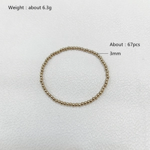 Detailed view of 3mm gold stainless steel beaded bracelet with 6.3g weight specifications
