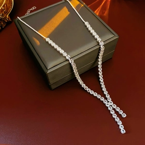 Elegant silver Y-shaped tassel necklace with clear zircons on grey leather box