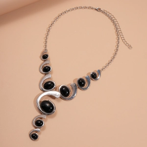 Retro geometric necklace with irregular silver metal links and oval black gemstones