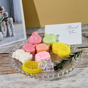 Detailed view of colorful cartoon animal silicone molds on a decorative glass tray