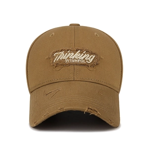 Distressed cotton baseball cap in brown with embroidered Thinking WISHFUL text