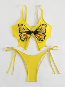 Detailed flat lay of a yellow two-piece bikini featuring a butterfly wing print top