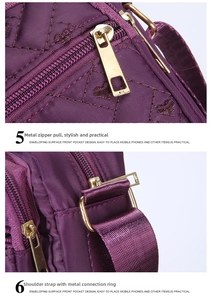 Close-up of purple heart quilted oxford fabric and premium gold metal zipper details