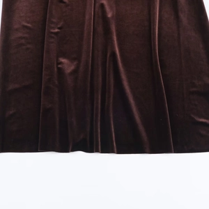 Elegant chocolate brown velvet maxi dress with a slim fit and smooth draped fabric finish