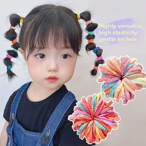 Close-up of high-elastic colorful beaded hair ties and kids ponytail styling on white base