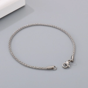 Detail of minimalist stainless steel popcorn chain bracelet with lobster clasp closure