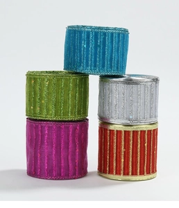Macro detail of five sparkling Christmas ribbon rolls with glitter stripes and mesh texture