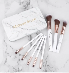 Detail of 8pcs marble pattern makeup brushes with rose gold ferrules in a tin box
