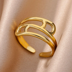 Detail of 18k gold plated stainless steel hollow geometric ring on satin fabric