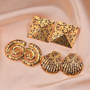 Three-piece leopard print earring set featuring geometric shell and spiral gold studs