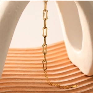 Detail of 18k gold plated stainless steel chain link bracelet with adjustable extender