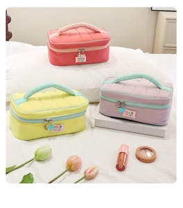 Quilted makeup bags in pink, yellow and purple with cute charms and tulip decor