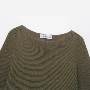 Olive green knit top with a round neckline and fine mesh texture in a flat lay view