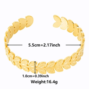 Close-up of golden laurel leaf cuff bracelet showing detailed dimensions and weight