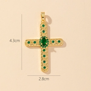 Detail of a gold-plated cross pendant with green stones and 4.3cm by 2.8cm dimensions