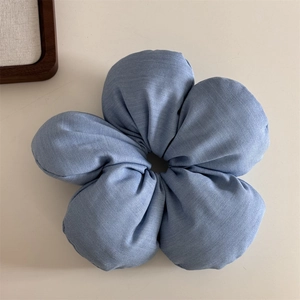 Detailed view of a blue 3D flower hair scrunchie made of soft cotton linen fabric